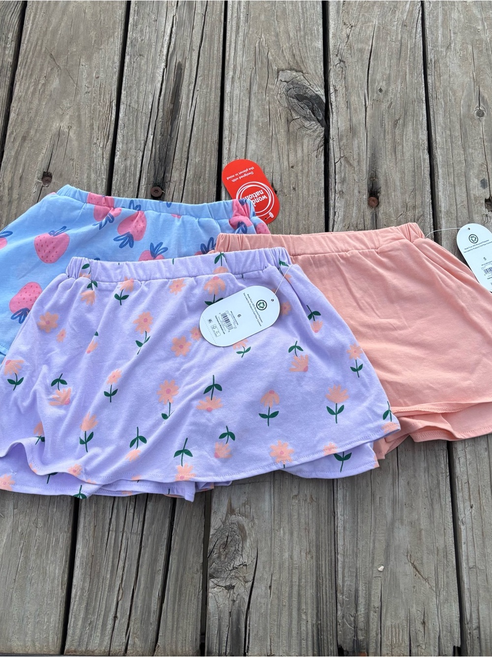 Little Girls Scooter skirts lot of 3- purple floral, pink and blue strawberry